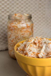 Russian traditional sauerkraut. Preparation with cabbage, sugar and salt for winter.